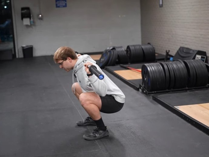 Athlete holding the bottom of a deep squat